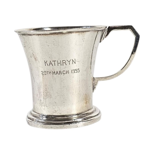 24 - A MID CENTURY CONTINENTAL SILVER CHRISTENING MUG
Single Art Deco handle and engraved inscription dat... 