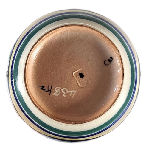 245 - TWO ART DECO POOLE POTTERY JUGS,
Comprising a baluster vase with a leaping gazelle motif (pattern 43... 