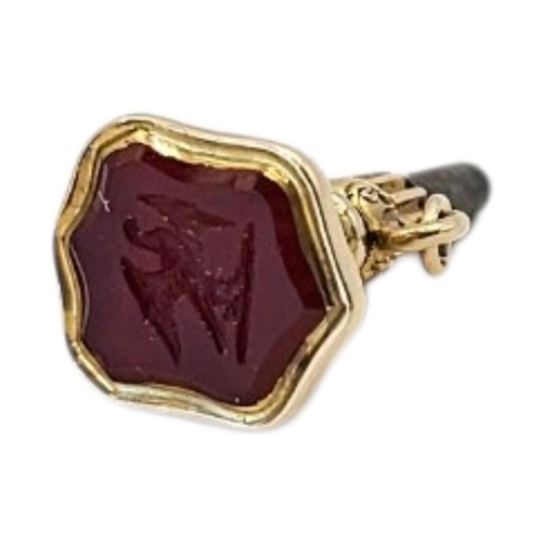 77 - A 19TH CENTURY YELLOW METAL AND HARDSTONE INTAGLIO POCKET WATCH KEY
Shield finial with intaglio bird... 