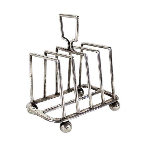 90 - AN EARLY VICTORIAN SILVER SQUARE TOASTRACK
On ball foot, hallmarked Sheffield, 1897.
(approx 8cm, ap... 