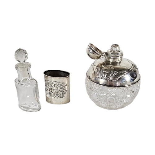 96 - TWO EARLY 20TH CENTURY SILVER AND CUT GLASS ‘REYNOLDS ANGELS’ SCENT BOTTLES
To include a larger bott... 