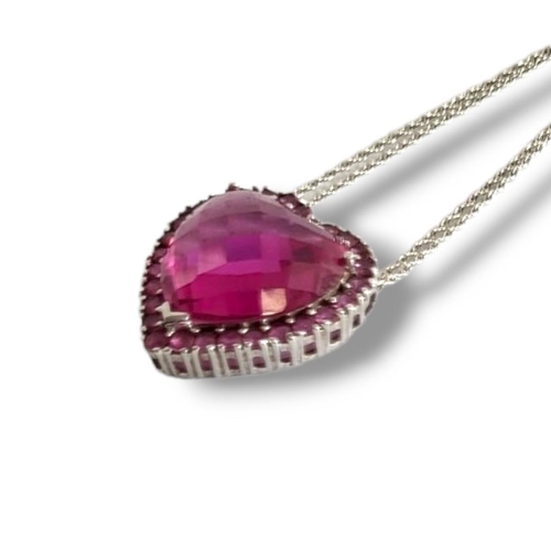 160 - AN AMERICAN 10CT WHITE GOLD SEMIPRECIOUS HEART FORM PENDANT 
On a delicate matching chain, marked 10... 