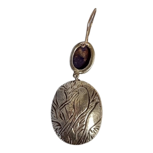 195 - A PAIR OF WHITE METAL DIAMOND AND LAPIS LAZULI EARRINGS 
Having a cabochon cut lapis stone edged wit... 