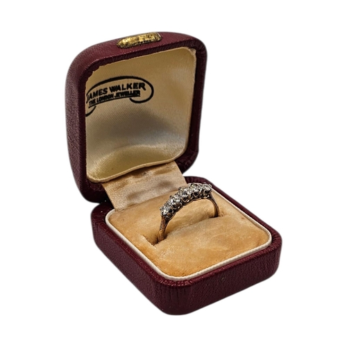 133 - AN EARLY 20TH CENTURY 18CT GOLD FIVE STONE DIAMOND RING
Having a row of graduated round cut stones, ... 