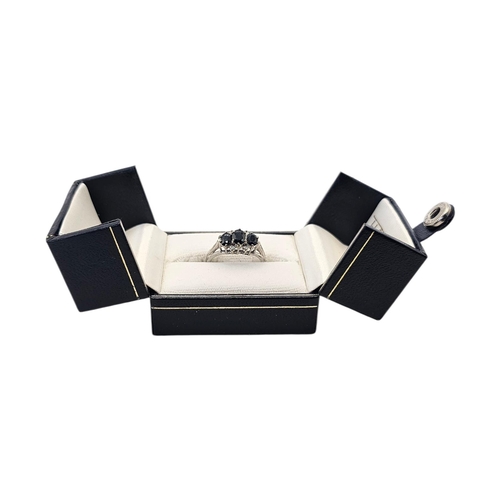 132 - A VINTAGE 18CT GOLD, OPAL AND DIAMOND RING
The central oval cut opal flanked with round cut diamonds... 