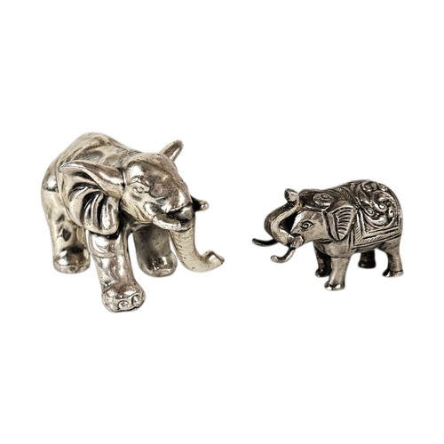 140 - A VINTAGE SILVER FILLED ELEPHANT PAPERWEIGHT
Standing pose marked ‘remeito’ 925, together with a sma... 