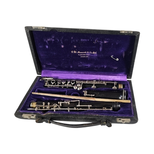104 - A CASED MID 20TH CENTURY HOWARTH AND CO LONDON PROFESSIONAL OBOE
Silver plated keywork, thumbplate s... 