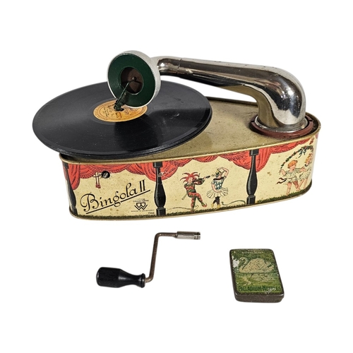 112 - A RARE GERMAN 'BINGOLA II' TINPLATE TOY GRAMOPHONE
By Bing Werke, Nuremberg, the base featuring a th... 