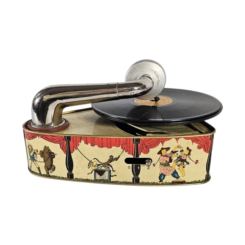 112 - A RARE GERMAN 'BINGOLA II' TINPLATE TOY GRAMOPHONE
By Bing Werke, Nuremberg, the base featuring a th... 