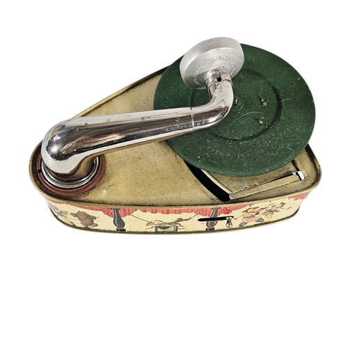 112 - A RARE GERMAN 'BINGOLA II' TINPLATE TOY GRAMOPHONE
By Bing Werke, Nuremberg, the base featuring a th... 