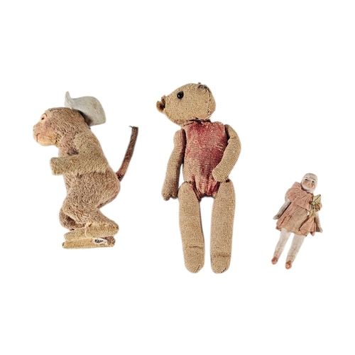 115 - AN EARLY 20TH CENTURY ‘CLOCKWORK’ MONKEY TOY
Key wind mechanism, together with a miniature jointed s... 