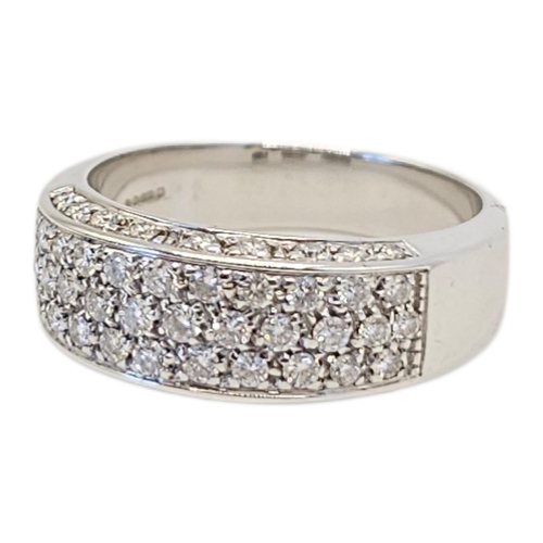 129 - AN 18CT WHITE GOLD AND DIAMOND THREE ROW RING
Three rows of round cut diamonds with diamonds set to ... 