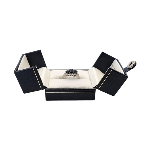 132 - A VINTAGE 18CT GOLD, OPAL AND DIAMOND RING
The central oval cut opal flanked with round cut diamonds... 