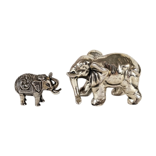 140 - A VINTAGE SILVER FILLED ELEPHANT PAPERWEIGHT
Standing pose marked ‘remeito’ 925, together with a sma... 