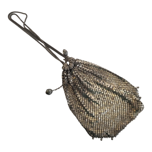 145 - A VINTAGE CONTINENTAL WHITE METAL MESH PURSE
Square form with wire draw strings.
(approx 17cm x 17cm... 