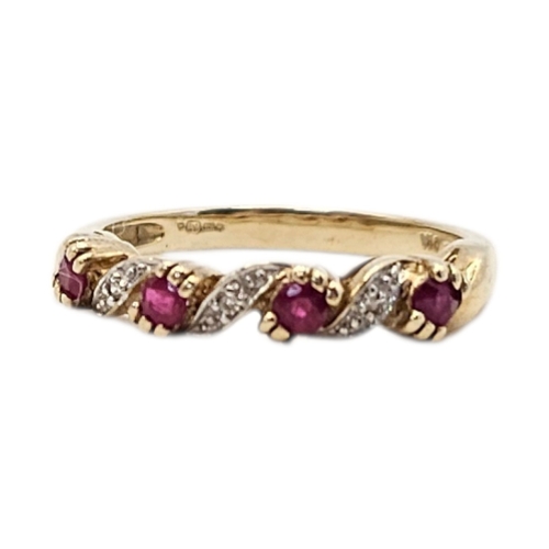 157 - A VINTAGE 9CT GOLD, RUBY AND DIAMOND HALF TWIST RING
Having a row of round cut rubies interspersed w... 