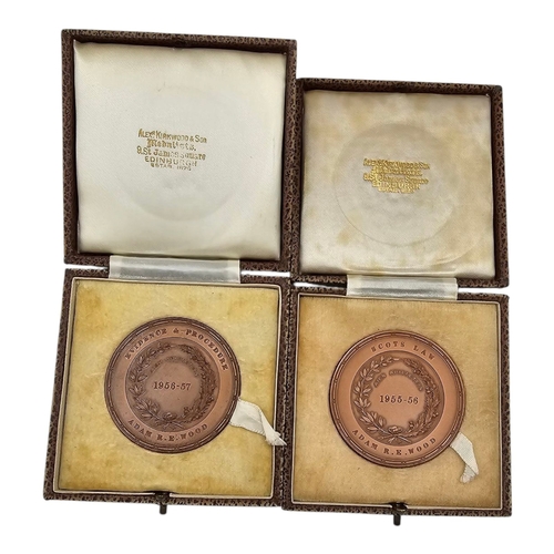 159 - A PAIR OF ST. ANDREWS UNIVERSITY COMMEMORATIVE BRONZE MEDALLIONS
Bearing the motto ‘University’s San... 
