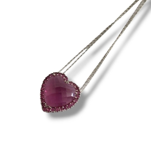 160 - AN AMERICAN 10CT WHITE GOLD SEMIPRECIOUS HEART FORM PENDANT 
On a delicate matching chain, marked 10... 