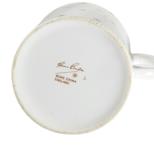 163 - SUSIE COOPER, A VINTAGE PORCELAIN COFFEE SET
Comprising six cups and saucers with harlequin coloured... 