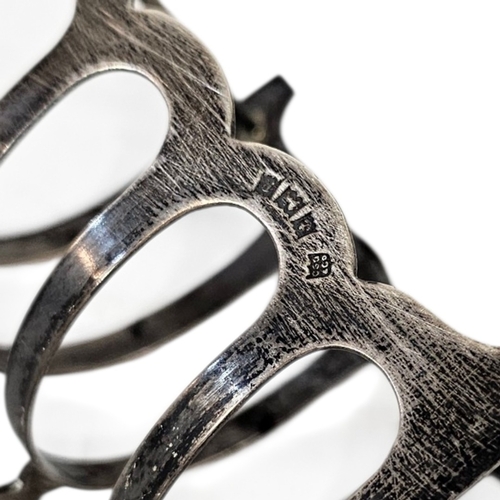 19 - TWO EARLY 20TH CENTURY SILVER TOASTRACKS
Each with a single handle, hallmarked Birmingham, 1940 and ... 