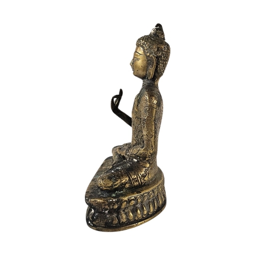 200 - AN EARLY 20TH CENTURY TIBETAN BRONZE FIGURE OF GUATAMA BUDDHA 
Depicted seated in dhyanasana (medita... 