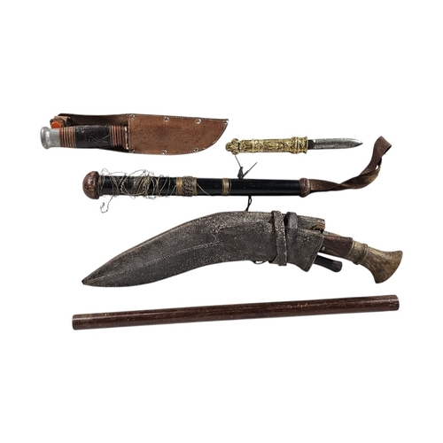 204 - A MIXED GROUP OF MILITARIA AND CURIOS
Comprising a Nepalese Kukri with karda and chakmak in leather ... 