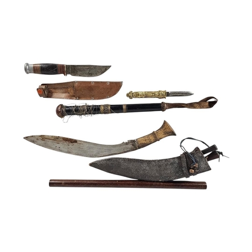 204 - A MIXED GROUP OF MILITARIA AND CURIOS
Comprising a Nepalese Kukri with karda and chakmak in leather ... 