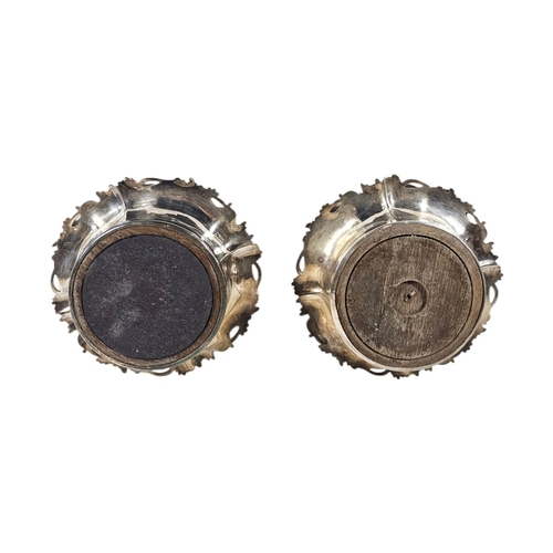 20A - A PAIR OF EARLY 20TH CENTURY SILVER PLATED WINE COASTERS
Having a vine leaf border and mahogany base... 