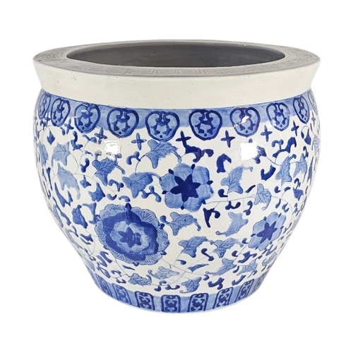 226 - A LARGE 20TH CENTURY CHINESE BLUE AND WHITE PORCELAIN FISH BOWL
Decorated in cobalt blue with scroll... 