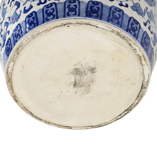 226 - A LARGE 20TH CENTURY CHINESE BLUE AND WHITE PORCELAIN FISH BOWL
Decorated in cobalt blue with scroll... 
