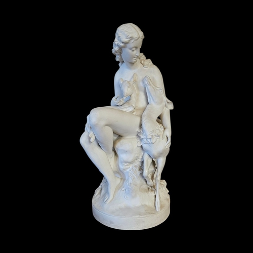 237 - A VICTORIAN PARIAN ‘DIANA THE HUNTRESS’ FIGURAL GROUP 
Seated on a rocky outcrop cradling a fawn, a ... 