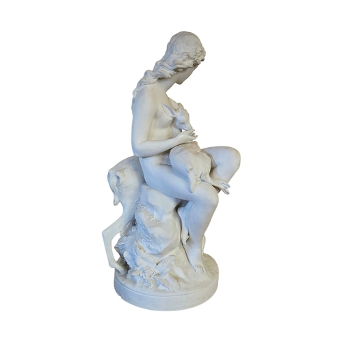 237 - A VICTORIAN PARIAN ‘DIANA THE HUNTRESS’ FIGURAL GROUP 
Seated on a rocky outcrop cradling a fawn, a ... 