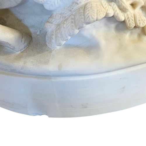 237 - A VICTORIAN PARIAN ‘DIANA THE HUNTRESS’ FIGURAL GROUP 
Seated on a rocky outcrop cradling a fawn, a ... 