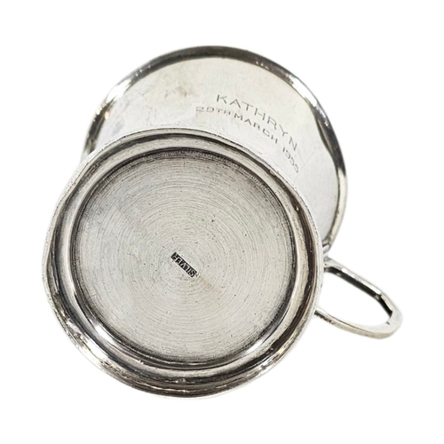 24 - A MID CENTURY CONTINENTAL SILVER CHRISTENING MUG
Single Art Deco handle and engraved inscription dat... 