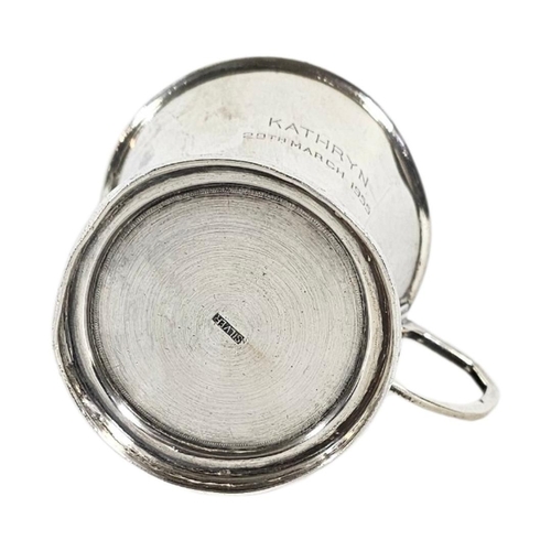 24 - A MID CENTURY CONTINENTAL SILVER CHRISTENING MUG
Single Art Deco handle and engraved inscription dat... 