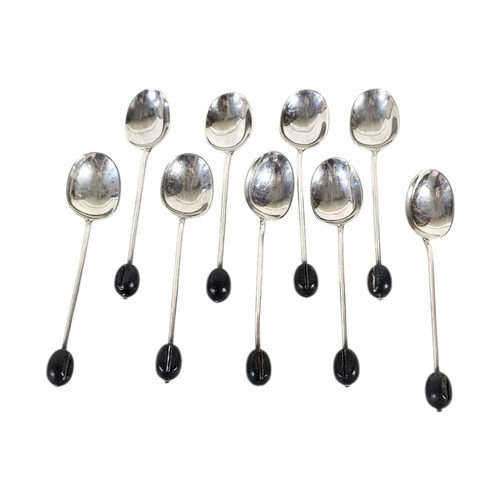 30 - A SET OF NINE VINTAGE SILVER COFFEE BEAN SPOONS
Each having a black bean finial, hallmarked Sheffiel... 