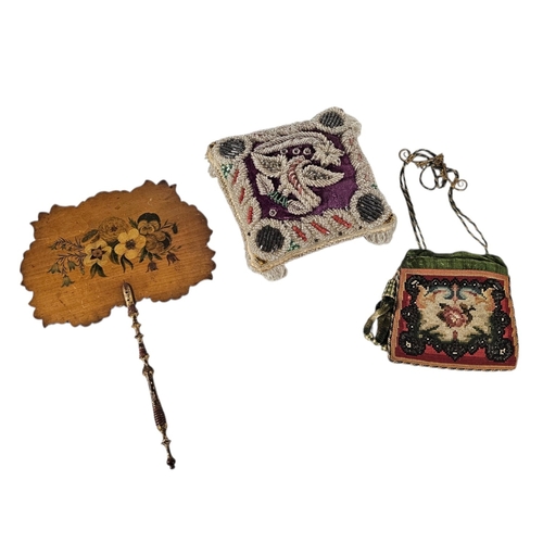 307 - A VICTORIAN BEADWORK CUSHION
Featuring a bird motif in seed and bugle beads, a Victorian fixed scree... 