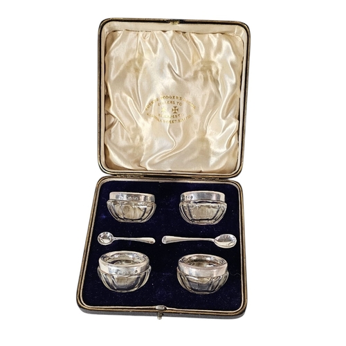 34 - A SET OF FOUR VICTORIAN SILVER AND GLASS SALTS
Each set with a silver rim hallmarked Joseph Rodgers,... 