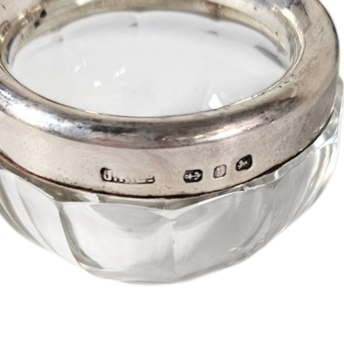 34 - A SET OF FOUR VICTORIAN SILVER AND GLASS SALTS
Each set with a silver rim hallmarked Joseph Rodgers,... 