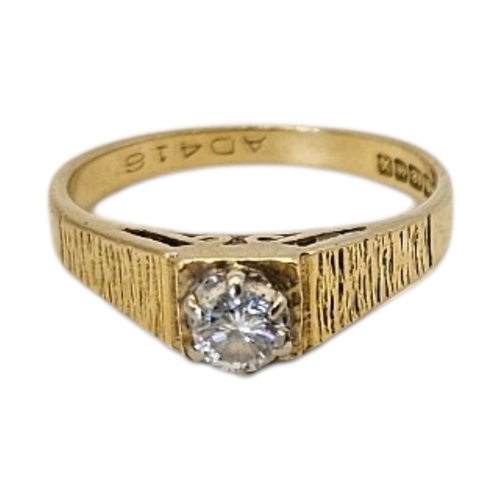 48 - A VINTAGE 18CT GOLD AND DIAMOND SOLITAIRE RING
Single round cut stone with bark design to shoulders.... 