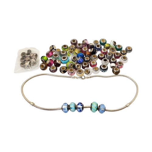 61 - A VINTAGE SILVER LOVELINKS NECKLACE AND ART GLASS CHARMS
A diverse grouping of approximately 50 bead... 