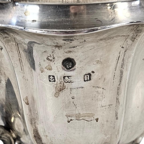 80 - AN EARLY 20TH CENTURY SILVER TEAPOT
Having a scalloped edge and ebonized handle, hallmarked.
(approx... 