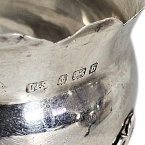 87 - A VICTORIAN SILVER SUGAR AND CREAM SET
Matched set comprising two cream jugs and a sugar bowl with s... 