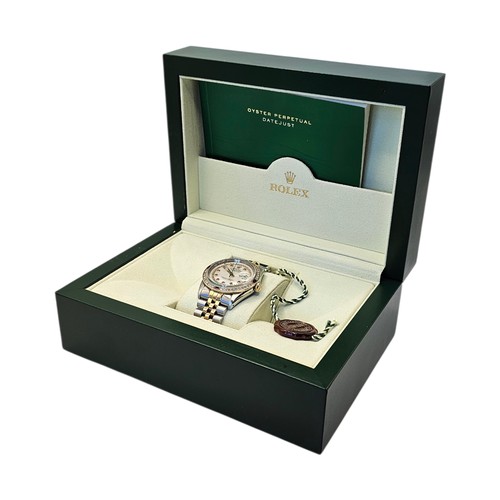 10A - ROLEX, DATEJUST, AN 18CT GOLD, STAINLESS STEEL, DIAMOND AND RUBY GENT’S WRISTWATCH
Having baguette c... 