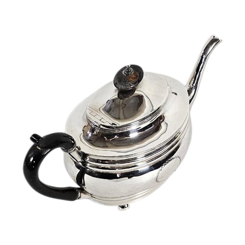 1 - A GEORGIAN SILVER OVAL TEAPOT
With engraved cartouche, having ebonised finial and handle, hallmarked... 