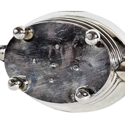 1 - A GEORGIAN SILVER OVAL TEAPOT
With engraved cartouche, having ebonised finial and handle, hallmarked... 