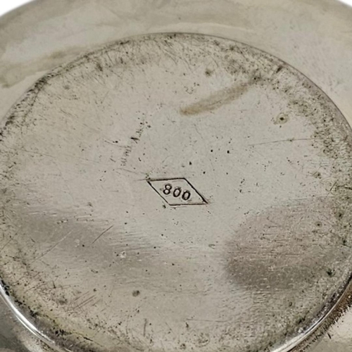6 - A COLLECTION OF FOUR EARLY 20TH CENTURY TURKISH SILVER COIN SET DISHES
The base set with Turkish ott... 