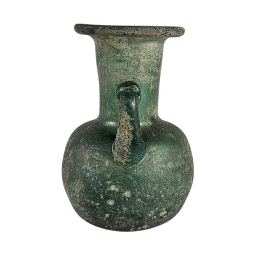 18 - AN EARLY 20TH CENTURY ‘ROMAN DESIGN’SODA GLASS JUG
Single handle with pitted iridescent finish.
(app... 