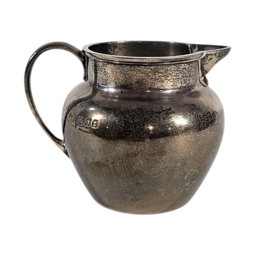 19 - AN EARLY 20TH CENTURY SILVER CREAM JUG
Plain form, hallmarked London, 1932.
(approx 7cm, approx 143.... 