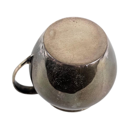 19 - AN EARLY 20TH CENTURY SILVER CREAM JUG
Plain form, hallmarked London, 1932.
(approx 7cm, approx 143.... 